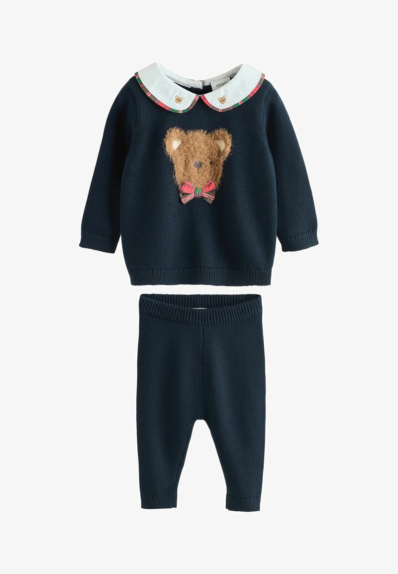 Navy sweater with a fluffy bear face design and plaid bow, paired with matching navy knit pants. Features a white collar with bear motifs.