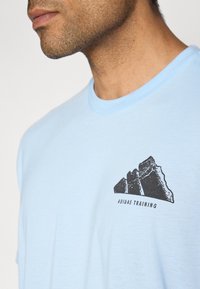 adidas Performance Sports T-shirts - glow blue