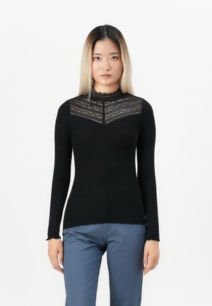 Black long-sleeve top with a lace pattern along the neckline, featuring a ribbed texture and scalloped edges at the hem and cuffs.