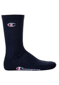 Navy cotton crew sock with ribbed texture, featuring a white and red Champion logo on the side and at the toe area.