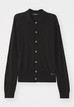 Black cardigan made of soft knit fabric, featuring a collared neckline, long sleeves, and gold button accents along the front.