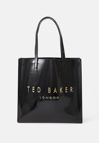 Sac tote en cuir verni noir avec deux longues poignées et logo en relief doré "TED BAKER LONDON" sur le devant. Texture lisse et brillante.