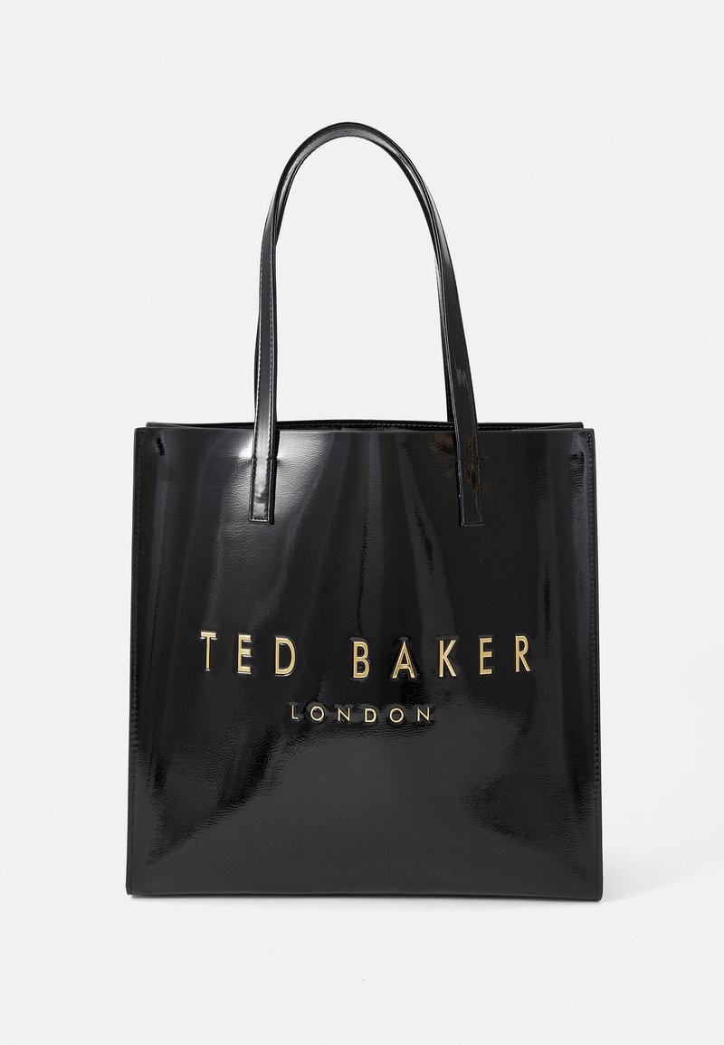 Sac tote en cuir verni noir avec deux longues poignées et logo en relief doré "TED BAKER LONDON" sur le devant. Texture lisse et brillante.