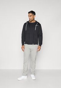 Champion GRAPHIC FULL ZIP HOODIE - Sweatjacke - black