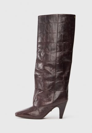 Dark brown crocodile-patterned knee-high leather boot with pointed toe and mid-height cone heel, side profile on white background.