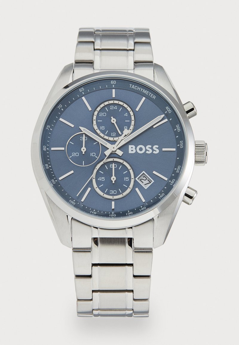 Silver stainless steel chronograph watch with a blue dial, three sub-dials, tachymeter, and date display. Features polished and brushed links.