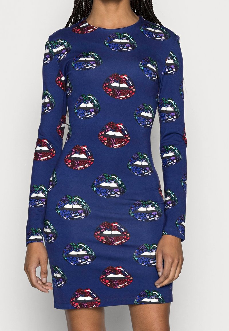 Navy blue long-sleeve dress patterned with large colorful lips decorated with floral designs in red, green, purple, and blue tones.