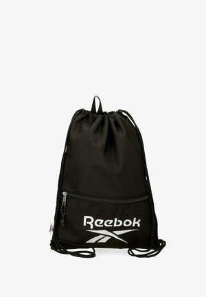 Bolsa de gimnasio negra de Reebok con cordón, bolsillo delantero con cremallera y logo blanco sobre un fondo blanco liso.