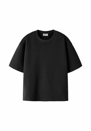 T-shirt noir à manches courtes côtelé avec encolure ronde et petit logo embossé en bas à gauche.