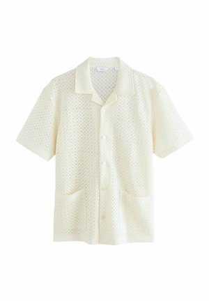 Korte mouwen shirt in crème met een gestructureerd ruitpatroon, voorzien van een notch-kraag, vijf knopen en twee voorzakken.
