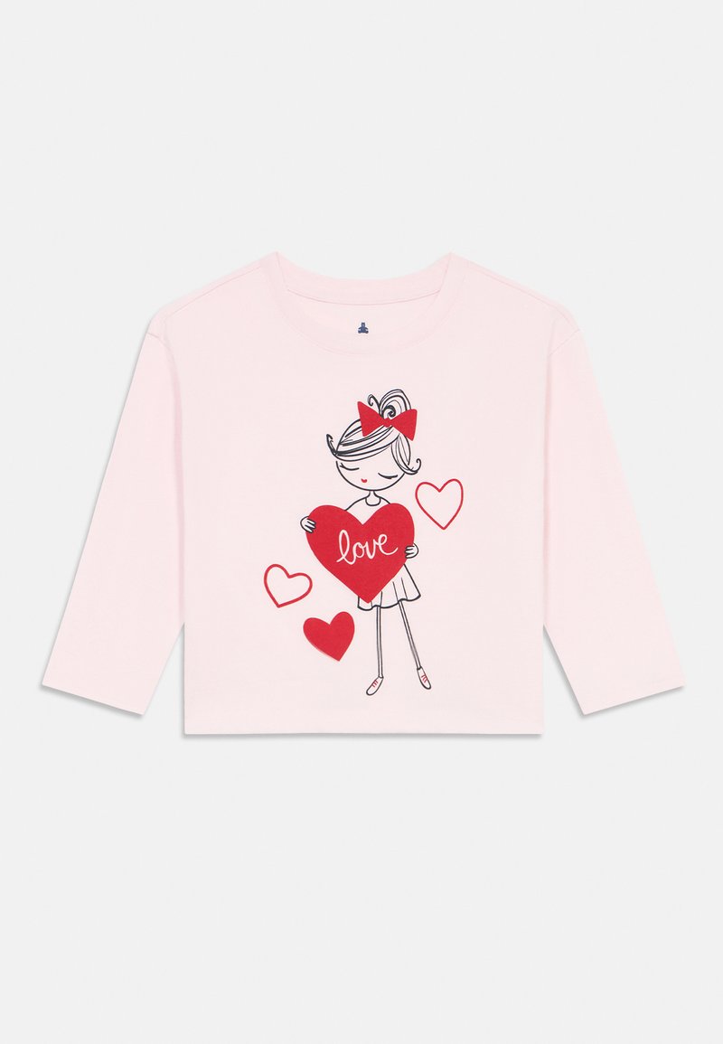 Light pink long-sleeve shirt with cartoon girl holding a large red heart labeled "love" and three smaller red hearts around her.