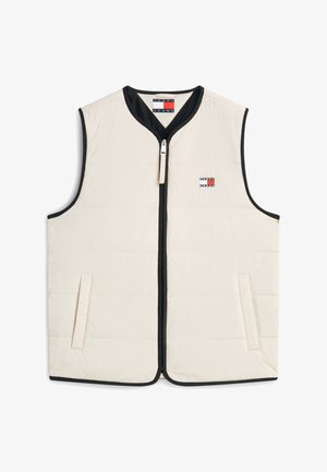 Beige mouwloze gewatteerde bodywarmer met zwarte bies, rits aan de voorkant, zijzakken en een klein Tommy Jeans-logo op de borst.