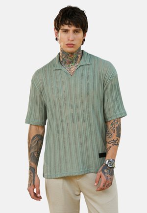 - Koszulka polo
