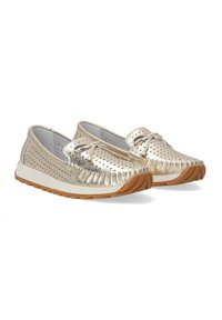 Metallic gold slip-on shoes with perforated design, bow detail, and fringed accents. Textured sole in brown for traction.