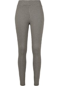 Fekete-fehér hounds-tooth mintás leggings sima textúrával, karcsú fazonnal és rugalmas derékkal. Nincs látható fémrész vagy díszítés.
