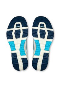 Two athletic shoe outsoles with a geometric tread pattern. Colors include navy blue, light blue, and white, with textured accents.