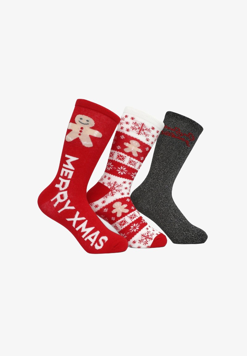 Tre paia di calzini festivi: rossi con un omino di pan di zenzero e "BUON NATALE", bianchi con un motivo a fiocchi di neve rossi, e neri metallici con accenti rossi.