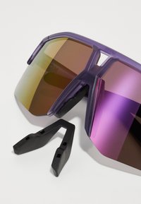 Purple sunglasses with gradient lenses in shades of brown and gold. Includes detachable black rubber components for comfort.