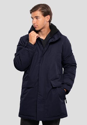 Navy insulated parka with a hood, featuring a zip front, two large front pockets, and textured cuffs. Made from a smooth, durable material.