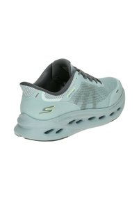 Light blue athletic shoe with mesh upper, gray accents, and cushioning sole featuring cutouts for breathability and flexibility.