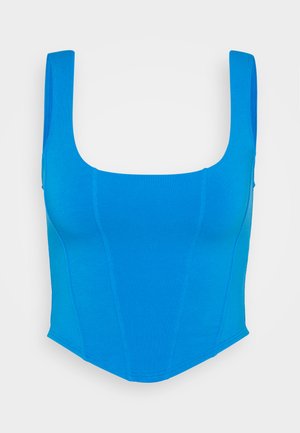 Blå tettsittende crop top med firkantet utringning og brede stropper. Laget av glatt stoff, med sømdetaljer og en strukturert silhuett.