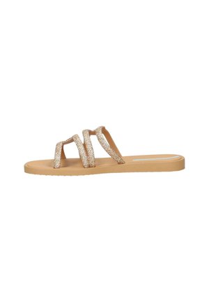Infradito con tre cinturini dorati scintillanti, suola in gomma beige e design piatto. I cinturini sono leggermente curvi e testurizzati per una migliore presa.