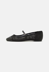 Black ballet flat featuring a rounded toe, mesh body, and a narrow strap across the instep with a buckle detail. Smooth rubber sole.