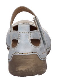 Light blue leather sandal with a closed heel, open sides, and adjustable strap. Textured brown sole and contrasting stitching details.