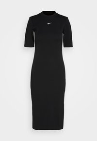 Svart figursydd klänning av stretchigt material, med hög hals och korta ärmar. Har en liten vit Nike-logotyp centrerad på bröstet.