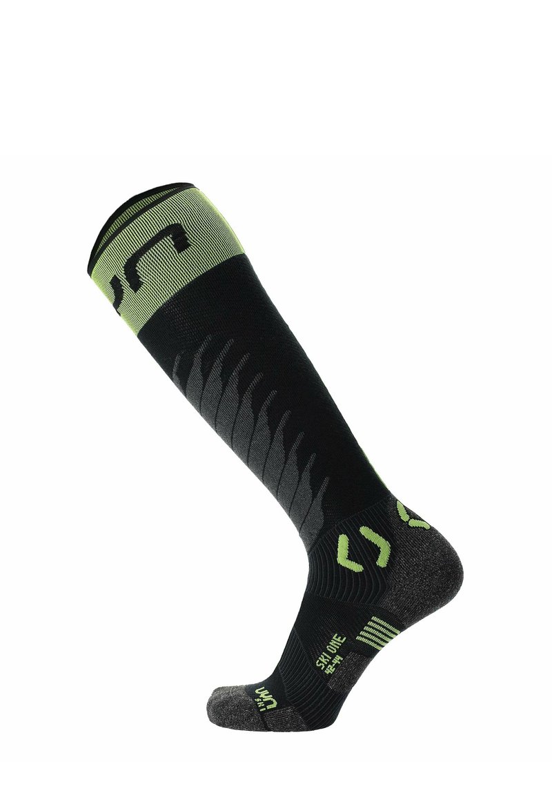 Calcetín negro y verde hasta la rodilla con un patrón texturizado; refuerzos en el talón y la puntera, con acentos de logo y zonas acolchadas para mayor comodidad.