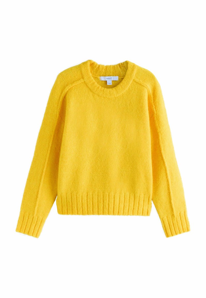 Lys gul sweater med rund hals, lange ærmer, ribbet kant og manchetter, lavet af blødt struktureret stof, med en afslappet pasform.