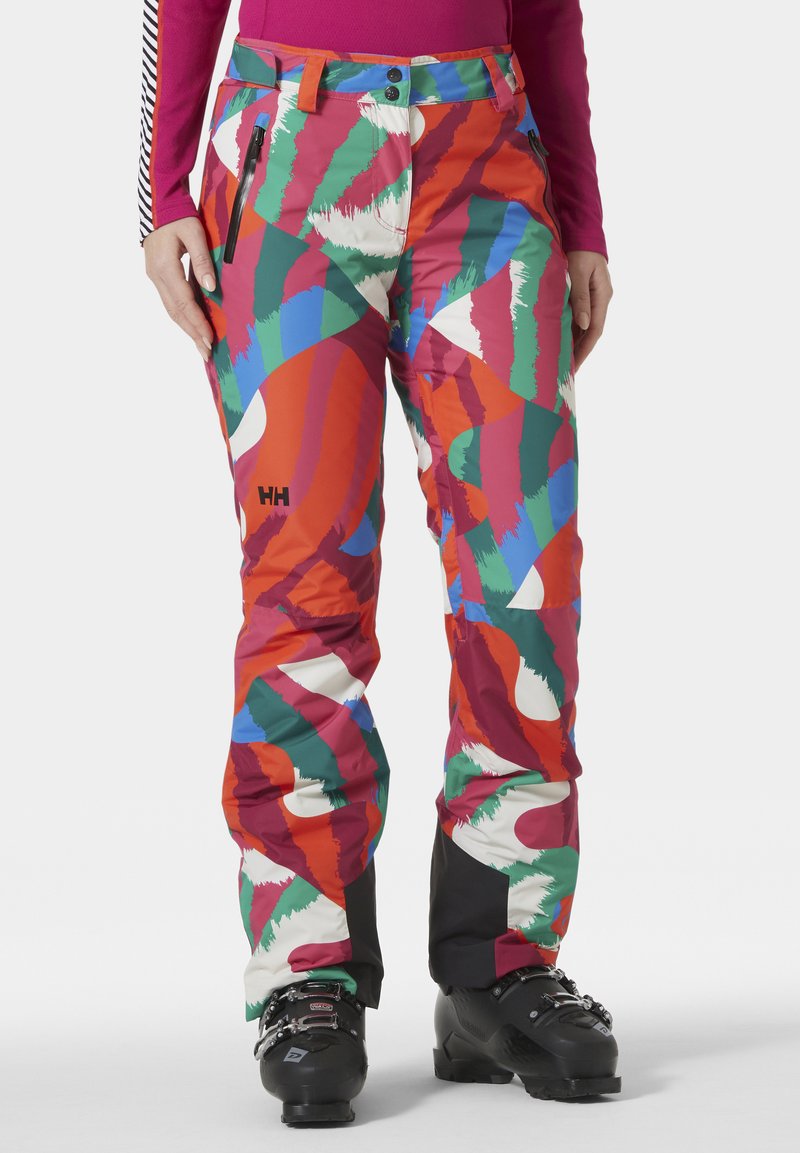 Kleurige skibroek met een gedurfd abstract patroon in rood, groen, blauw en wit. Gemaakt van duurzaam materiaal met een ritszak en logodetail.