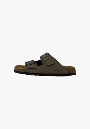 Sandalo marrone open-toe con due fibbie regolabili e suola in sughero, marchiato Grünland sul lato.
