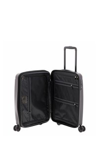 Valigia rigida nera con maniglia estraibile, quattro ruote e scomparti con zip, dotata di rivestimento in tessuto nero e tasche in rete.
