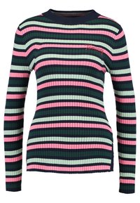Długi rękaw koszulka z prążkowanego materiału w poziome paski w kolorze granatowym, zielonym, różowym i jasnym zielonym. Posiada okrągły dekolt i subtelną haftowaną logo.