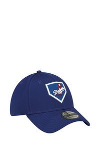 Casquette de baseball bleue en tissu texturé, avec une visière courbée et un logo des Dodgers en blanc et rouge sur un patch en forme de diamant. Comprend un autocollant New Era.