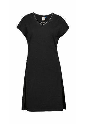 Robe noire à manches courtes avec un décolleté en V, des fentes latérales et une couture blanche contrastante le long du décolleté. Fabriquée en tissu doux.