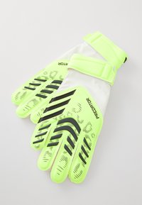 Gants de gardien de but avec un extérieur en latex jaune néon et des accents noirs, un motif de grip texturé et des sangles de poignet blanches ajustables.