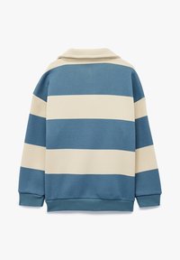 Oversized cotton sweatshirt featuring horizontal blue and cream stripes, a collar, and ribbed cuffs and hem. Smooth texture with a relaxed fit.