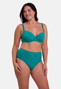 Soutien-gorge teal avec armatures et bretelles ajustables, associé à une culotte teal taille haute. Les deux ont un design épuré, avec des accents dorés décoratifs.