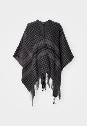 Rutet poncho i nuancer af grå og sort, med frynser nederst og et løst, åbent design. Fremstillet af blødt stof for behagelig brug.