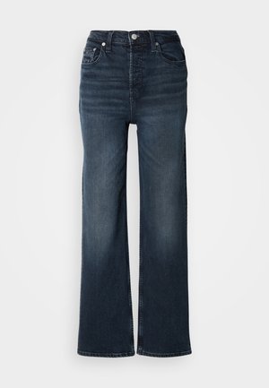 Tmavomodré široké džínsy vyrobené z denimovej látky. Vysoký pás s predným zapínaním na gombík a bočnými vreckami. Hladká textúra a klasický strih.