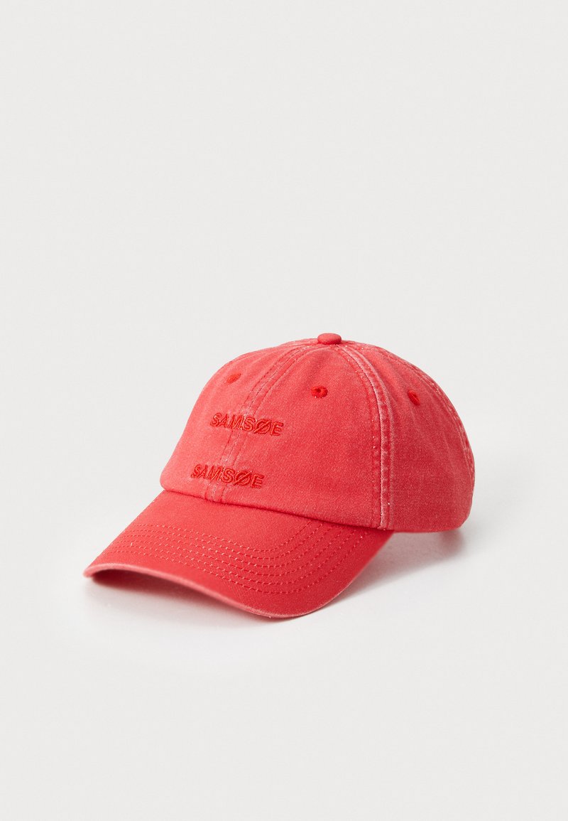 Red cotton baseball cap with a curved bill. Features two embroidered logos, "SAMØSÆ," on the front. Has visible stitching and eyelets.