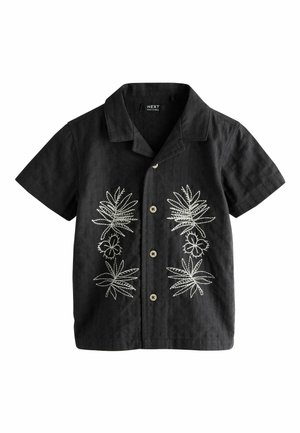 Fekete, rövid ujjú, gombos ing, fehér hímzett trópusi levelekkel és virágokkal elöl, kengurunyak-kivágással és négy bézs gombbal.