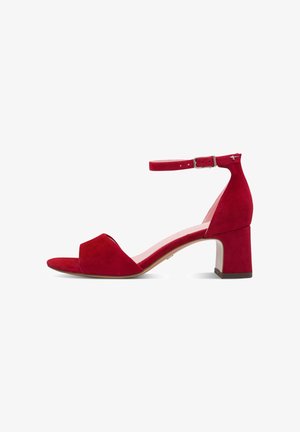 Red suede women's sandal with block heel and ankle strap, open toe design, and silver buckle closure.