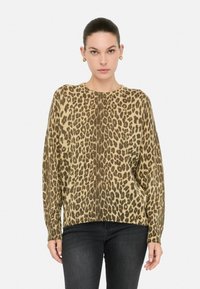 Maglione a stampa felino in beige e marrone, maniche lunghe, vestibilità comoda, tessuto a maglia testurizzato con polsini e orlo a coste.