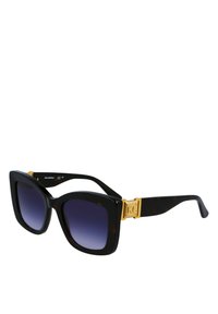 Oversized, vierkante zonnebril met een zwart schildpadframe en gradient paarse lenzen. Bevat gouden hardware met de initialen "KL" prominent weergegeven.