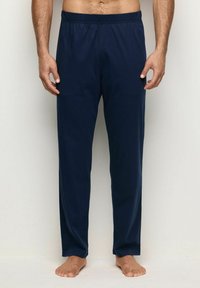 Navy sininen, kevyet, joustava vyötärö housut suoran lahkeen muotoilulla. Valmistettu pehmeästä kankaasta. Ei kuvioita tai koristeluja.