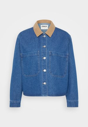 Jeansjakke med en lys brun corduroy-krave, sølvknapper, to forlommer og en afslappet pasform. Blå stof med en glat tekstur.