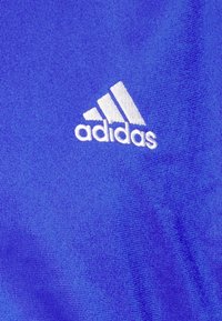 adidas Sportswear WEAR BASIC SET - Tuta - semi lucid blue